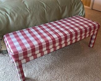 Custom upholstered bench includes extra fabric