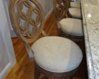 6 Bar Stools plus they swivel so if you have one drink too many you might be the life of the party!
