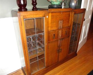 We nick named this a Prohibition Cabinet/ you can keep a little whisky or wine in it and then sit down and write your sweetheart a note at the desk.