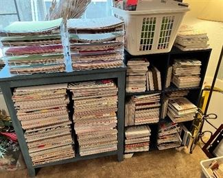 Large assortment of scrapbooking paper of various sizes. Single pages as well as books.
