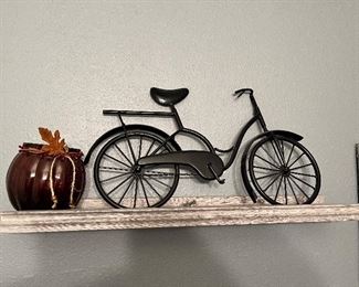 Floating shelf, wire, bicycle, and pumpkin decoration