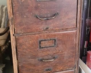 Antique wooden file cabinet (one side open as it was part of a "set"). Just put that side against a wall