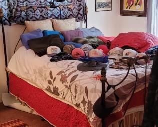 Bed available - comes with Martha Stewart coverlet set. Some Patagonia hats remain