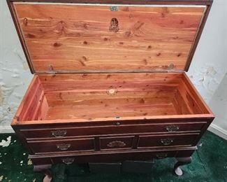 Cedar chest. Best of the lot.  Hutch that doubles as sealed cedar chest. Smells like it just came off showroom floor. Bottom drawer opens.