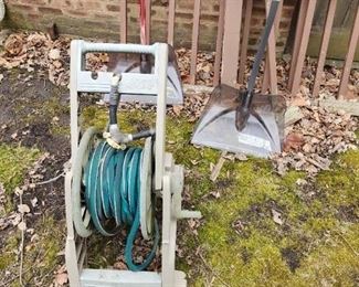 Garden hose on reel. 2 excellent snow shovels.
