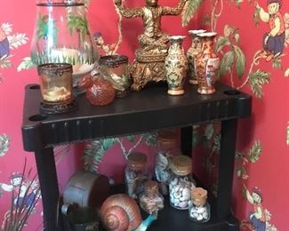 Monkey candle holder, snail, jars of seashells 