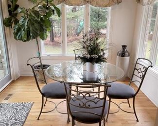 Gorgeous kitchen table and four chairs. Live plant. 
