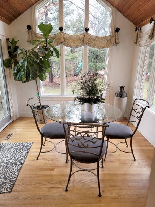 Gorgeous kitchen table and four chairs. Live plant. 