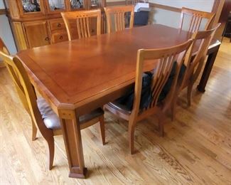 Mission style Thomasville dining room table and eight chairs. 