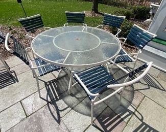 Tropitone glass top table with stack strap chairs EUC