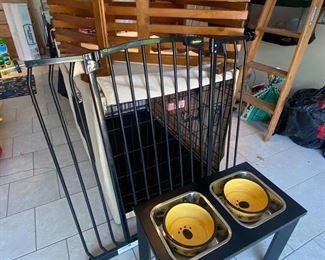 Raised feeding bowls and dog gate