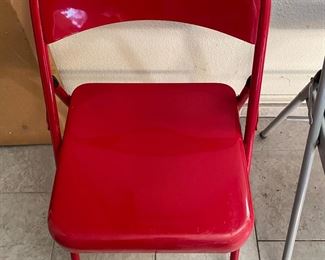 4 red folding chairs