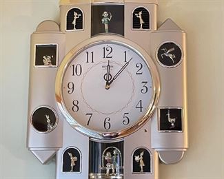 Rhythm clock with moving figures, 15"W x 19"H, $50