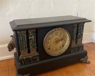 Antique clock. Brass accents. 