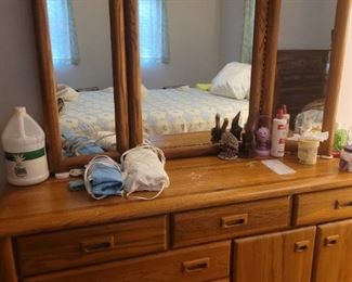 Triple dresser with a tri-fold mirror