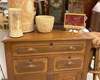 Washstand with galvanized lining. Top opens with false drawers. 