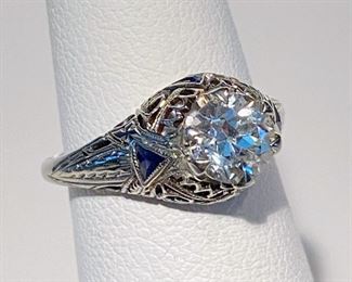 Platinum diamond ring with sapphire accents 