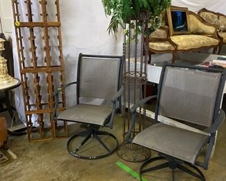 Patio items, wine rack, floral decor. 