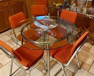 Chrome and glass dining table and 6 vintage Royal Seating Corporation chrome and orange dining chairs