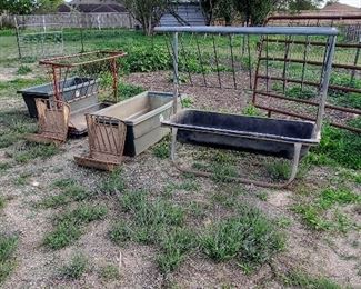 Livestock feeders and troughs