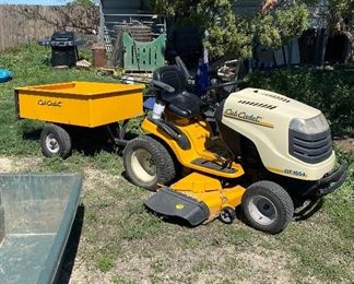 Cub Cadet GT 1554 Riding Lawnmower with trailer cart. Works great, the blade band has slipped off and will need to be reattached but is in great working condition as we’ve used it on the property to haul things. 