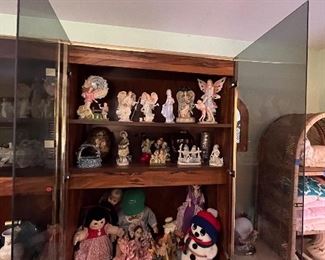 Extensive assortment of ceramic and wooden figurines, decorative and kitchen glassware, fine china sets and vintage dolls