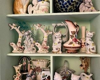 Extensive assortment of ceramic and wooden figurines, decorative and kitchen glassware, fine china sets and vintage dolls