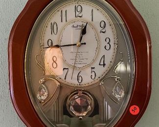 Musical, wooden wall clock