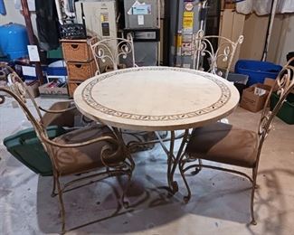 42-in patio table with cast iron rod iron chairs