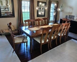 Ethan Allen dining table with 10 chairs and two leaves