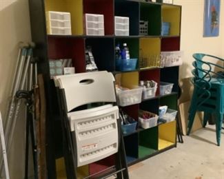 Multi colored shelf, folding chairs and aqua chairs have sold.