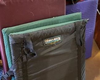 Several sleeping mats. Two can be made into seats