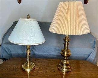 (2) Brass Colored Lamps
Both in working condition. Tallest is H33 1/2" with a pleated lampshade. Shorter is H27 1/2" with pleated lampshade showing some damage, and pinecone finial