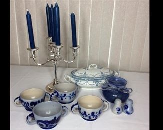 Blue Dishes and Decor
(1) silver-tone candelabra with blue candles - H18"; (1) oval ceramic dish, no markings - W13"; (4) crock-style soup bowls with matching salt and pepper shakers; (1) decorative blue glass bowl