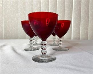 Duncan and Miller Ruby Red champagne glasses. H4 1/4". No apparent chips or cracks, but some scratches. Rings like crystal!!