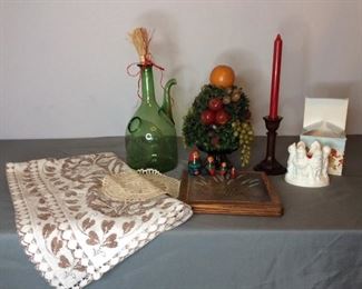 Home Decor
Includes (1) wood candlestick, (1) faux fruit topiary, (1) crocheted tablecloth and doily; (1) trivet, (1) Avon candle, (1) large green vase, and nesting dolls