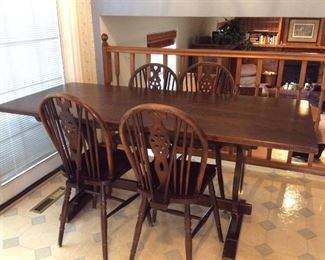 Wood Kitchen/Dining Table
=In the country style, includes a table - H29 1/2" x W66" x D29 1/2" and (5) chairs - H35 1/2" x W14" x D17 1/2". Well loved and used set. Table does wobble