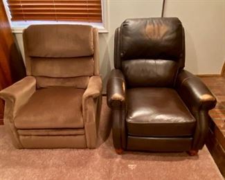 Lounging Recliners
(1) Brown corduroy-like recliner from Shannon Chair Company - Measures H37" x W35" x D35"; (1) Leather-like recliner with wooden finial legs made by Haining Highpoint Furniture, shows signs of wear along head and armrests - Measures H40" x W35"x D35".