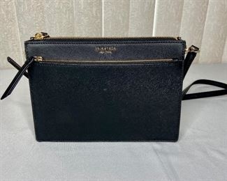 Kate Spade Crossbody Purse
Black leather purse with (2) zippered pockets and (1) internal pocket. In excellent condition. H9 1/2" x W7" x D2". Schur Success cannot verify authentication.