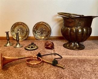 Gold, Bronze and Silver Toned Items
Includes a bronze colored pot, H20" x 14 1/2 x 12"; an equestrian buckle H8"; pair of brass-looking plates with scenes embossed, H9"; pair of unmarked silver-toned candlesticks, H6"; and more!