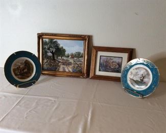 Netherland Countryside Art
(2) plates showing countryside scenes from what looks like the Netherlands - 10" diameter; Canvas countryside scene, H14" x W17". Artist signature indiscernible. Cottage framed print from artist, Carl Valente.