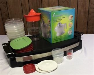 Kitchen Helpers
(1) Wolfgang Puck's Cafe Collection electric griddle - powers on; (1) Toastmaster Citrus Juicer with Pulp Adjuster; and Rubbermaid food containers with extra juicer top