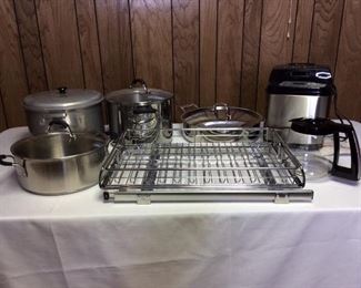 Kitchen Cookware
Includes (1) Comet stock pot, (1) Calphalon 2-handle pot, (1) Kitchenaid pot, (1) Cuisinart pan, (1) Cuisinart Coffee Pot - no maker, (1) Cook's Essentials Bread Maker - appears new, and a sliding cabinet drawer for install.