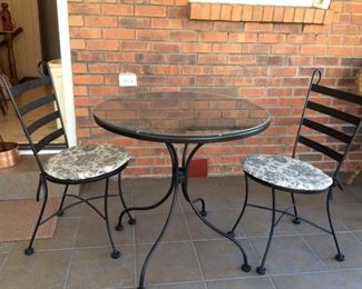 Metal Outdoor Table and Chairs and Side Table
Metal chairs with upholstered cushions, table with a glass top. Table - H29" x W30 1/2"; chairs - H35" x W16". Also includes metal buffet table - H27" x W33" x D10".