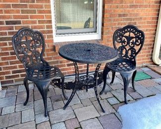 Metal Outdoor Seating Set
Table and chair set, in good shape with some scuffs and marks. Table - H27 1/2" x D26", Chairs - H36" x W17" x D16".
