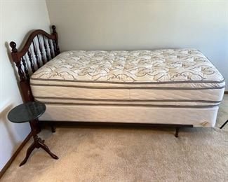 Twin Bed and End Table
Twin size dark wood headboard. Headboard has quite a few scratches. Mattresses are optional. H41" x W75" x D38". End table, H20 1/2" x D20". Dark wood base and green toned marble look top. Metal bed frame included. Mattress appears new.