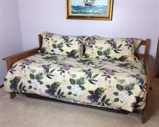 Twin Trundle Bed and Bedding
Twin Trundle Bed. Appears to be oak wood. Mission style design. Mattresses optional. Floral comforter and shams. Trundle is on wheels. H 36" x W 82" x D 38".