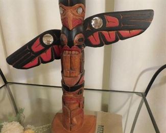 14" Beautifully carve totem from Canada.  Base gives description as "Thunderbird over Bear.  March 3, 2000.