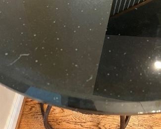 This is the dichromatic glass or something. Similar black glass on a iron base absolutely beautiful.