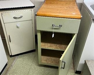Vintage cabinets, one with wood grain top